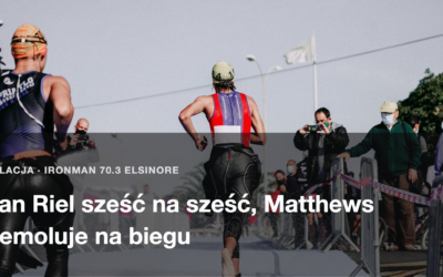 Zawodnik na ostatnich metrach biegu, kibice za barierkami