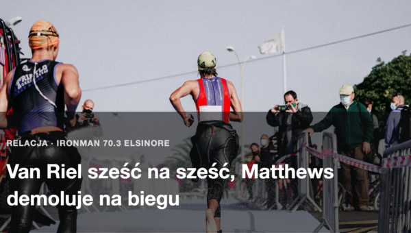 Zawodnik na ostatnich metrach biegu, kibice za barierkami