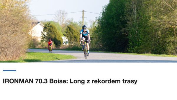 Kolarz na rowerze czasowym na wiejskiej drodze